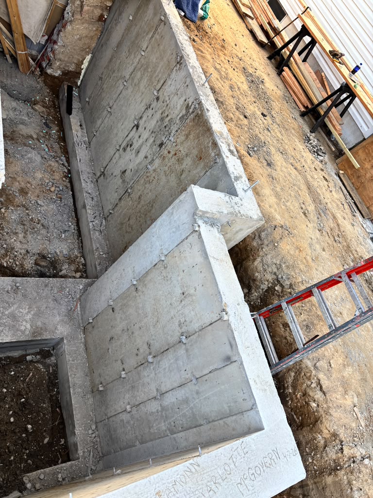 Concrete foundation walls during construction, from the Anastos Contractors project gallery